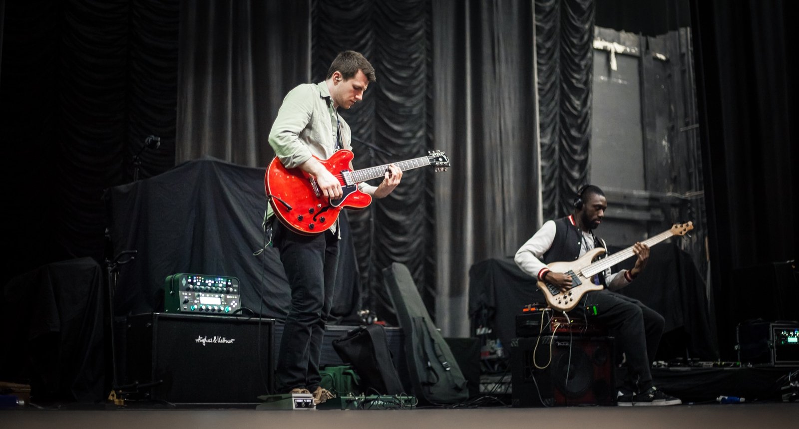 David Niskin performing electric guitar live on stage.